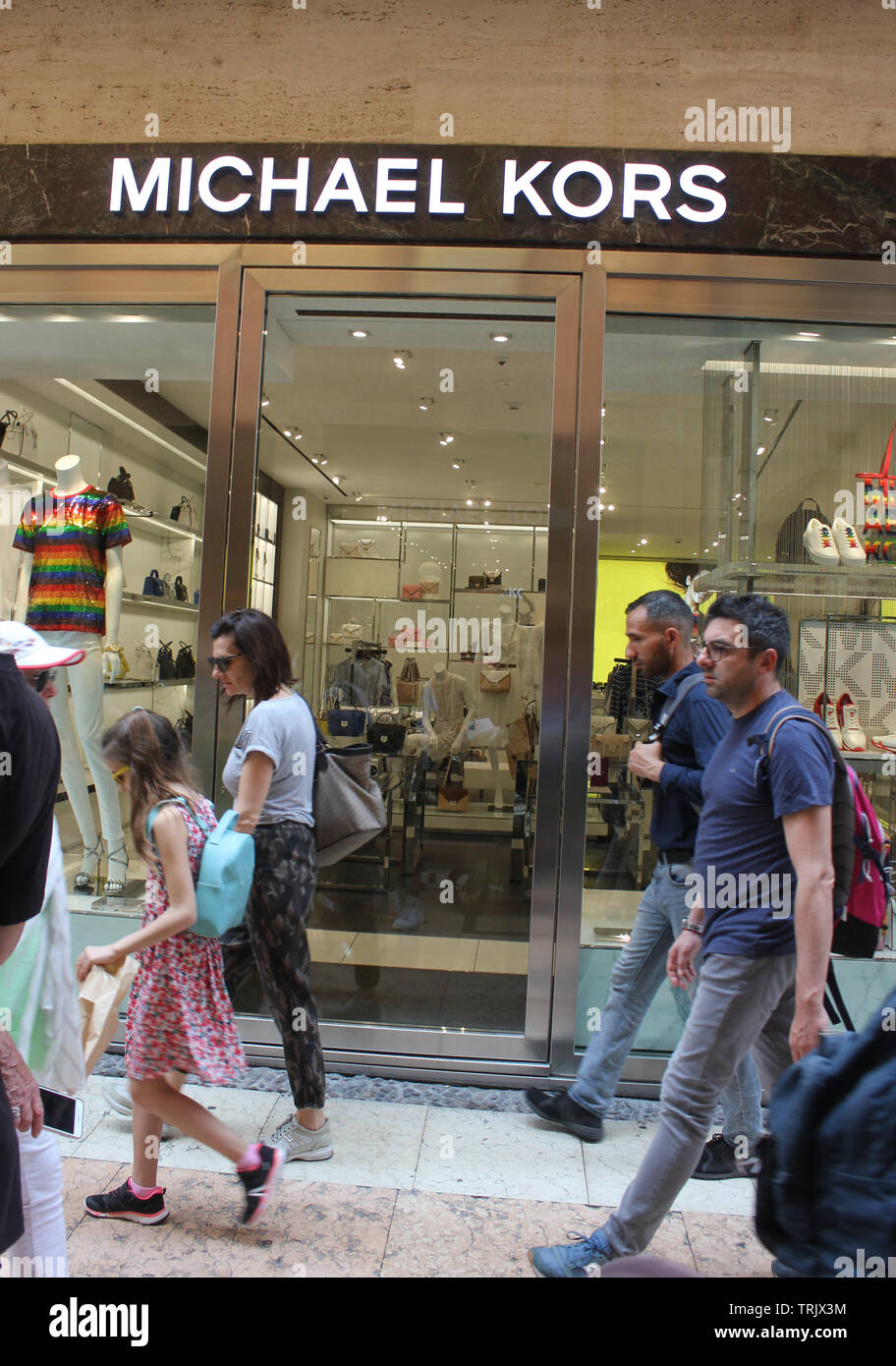 Michael Kors logo on store in Verona, Italy, pedestrian area, Customers passing stores in Verona, Via Mazzini Stock Photo