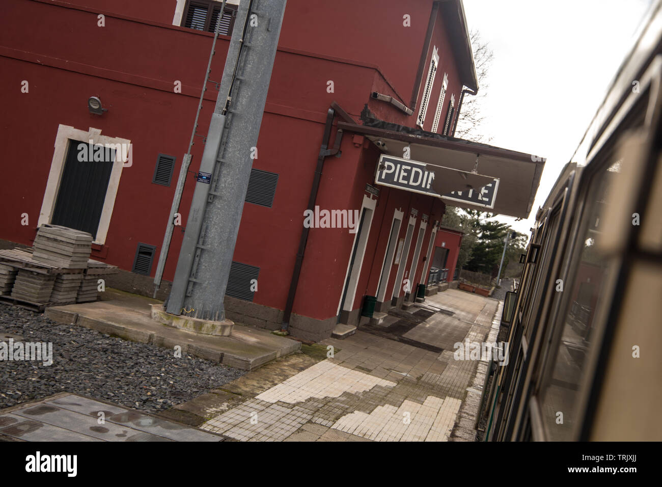 The Circumetnea railway slowly links the Sicilean cities of Catania and Giarre/Riposto trough a 950 mm track that goes around Etna volcano. Stock Photo