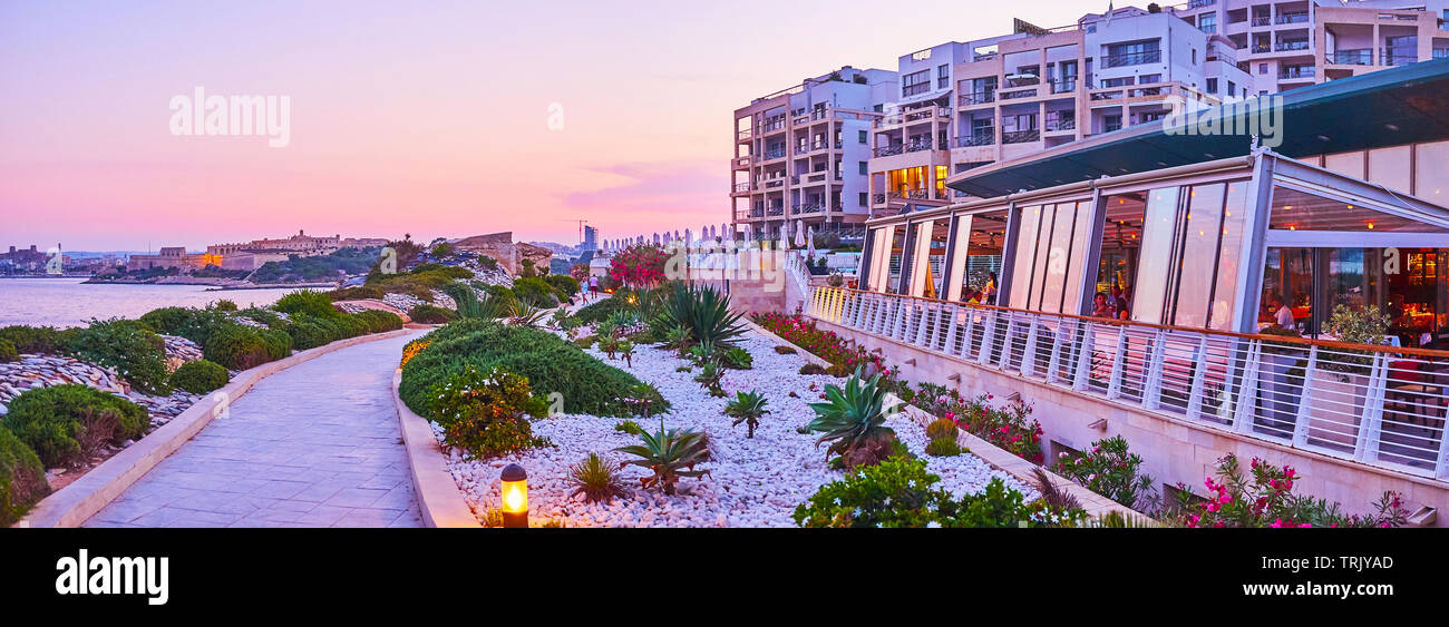 SLIEMA, MALTA - JUNE 19, 2018: Explore Tigne Point peninsula with its modern architectural complex, including hotel, restaurants, cafes and shopping m Stock Photo