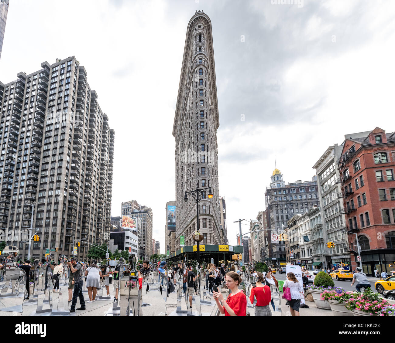 New York, USA,  7 June 2019. Visitors photograph a one-day art installation called 'The Shape of History' in New York City's Flatiron plaza. The installation organized by CNN and Hulu to promote their series 'The Handmaid's Tale' consists of 140 mirrored statues - the amount needed for equal gender representation in New York City, where only 5 out of the city's 145 statues represent women. Credit: Enrique Shore/Alamy Live News Stock Photo