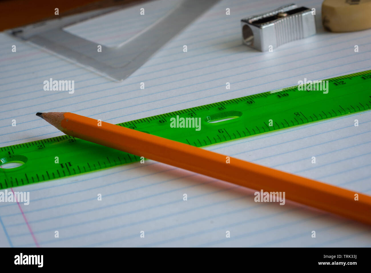 Pencil and rule on a notebook close up Stock Photo