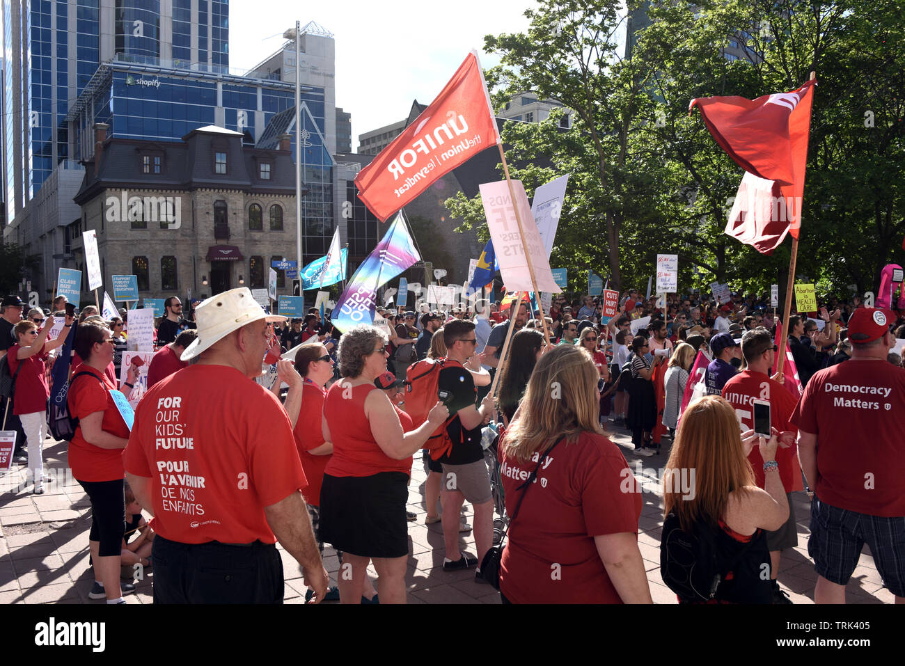 Ottawa, Canada - June 7, 2019:  Crowd gathers outside the courthouse to protest the moves made by Ontario Premier Doug Ford after his first year in power.  Ford has been taking a hit in recent polls. Stock Photo