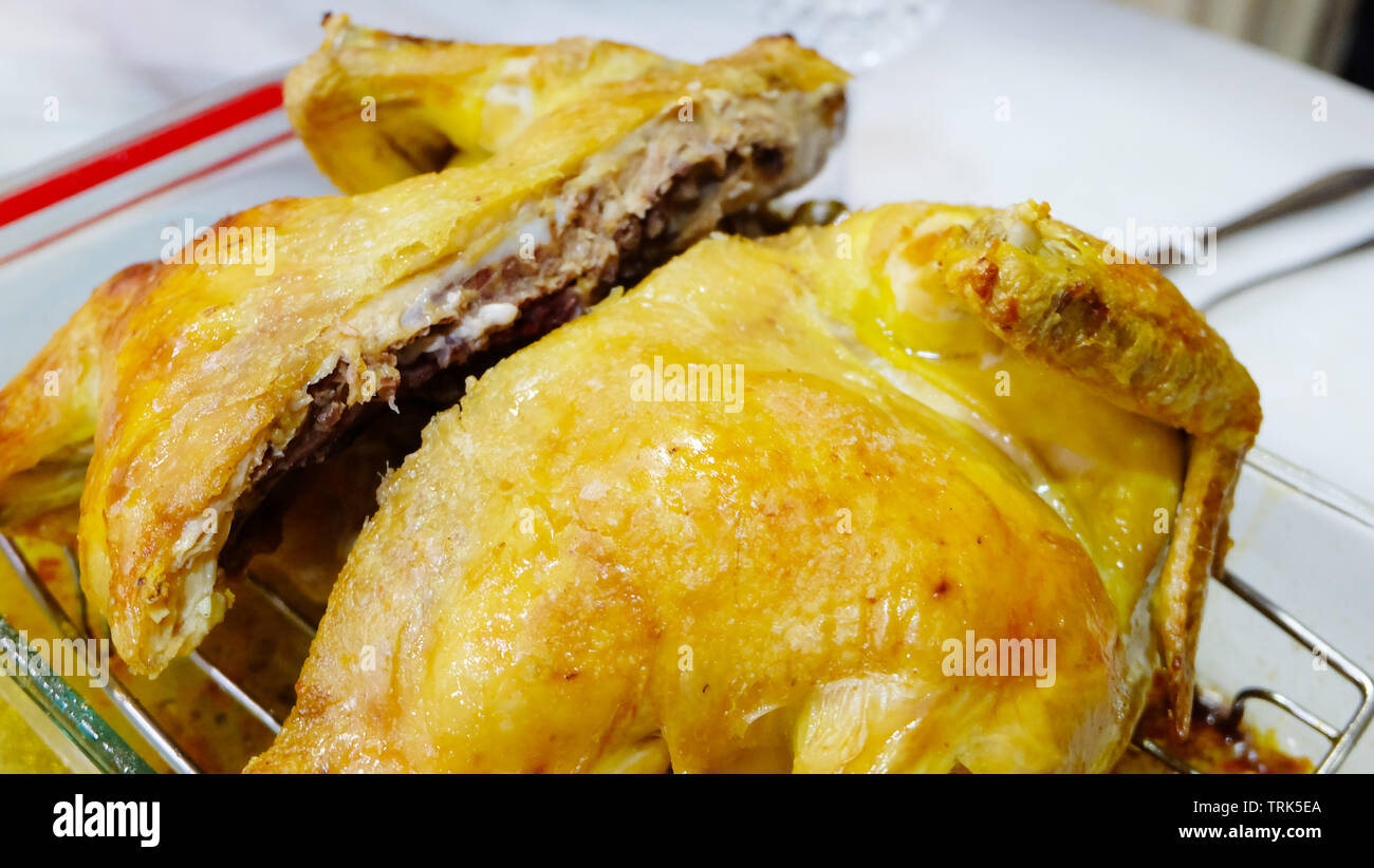 Baked chicken in a glass pan with golden crispy skin Stock Photo Alamy