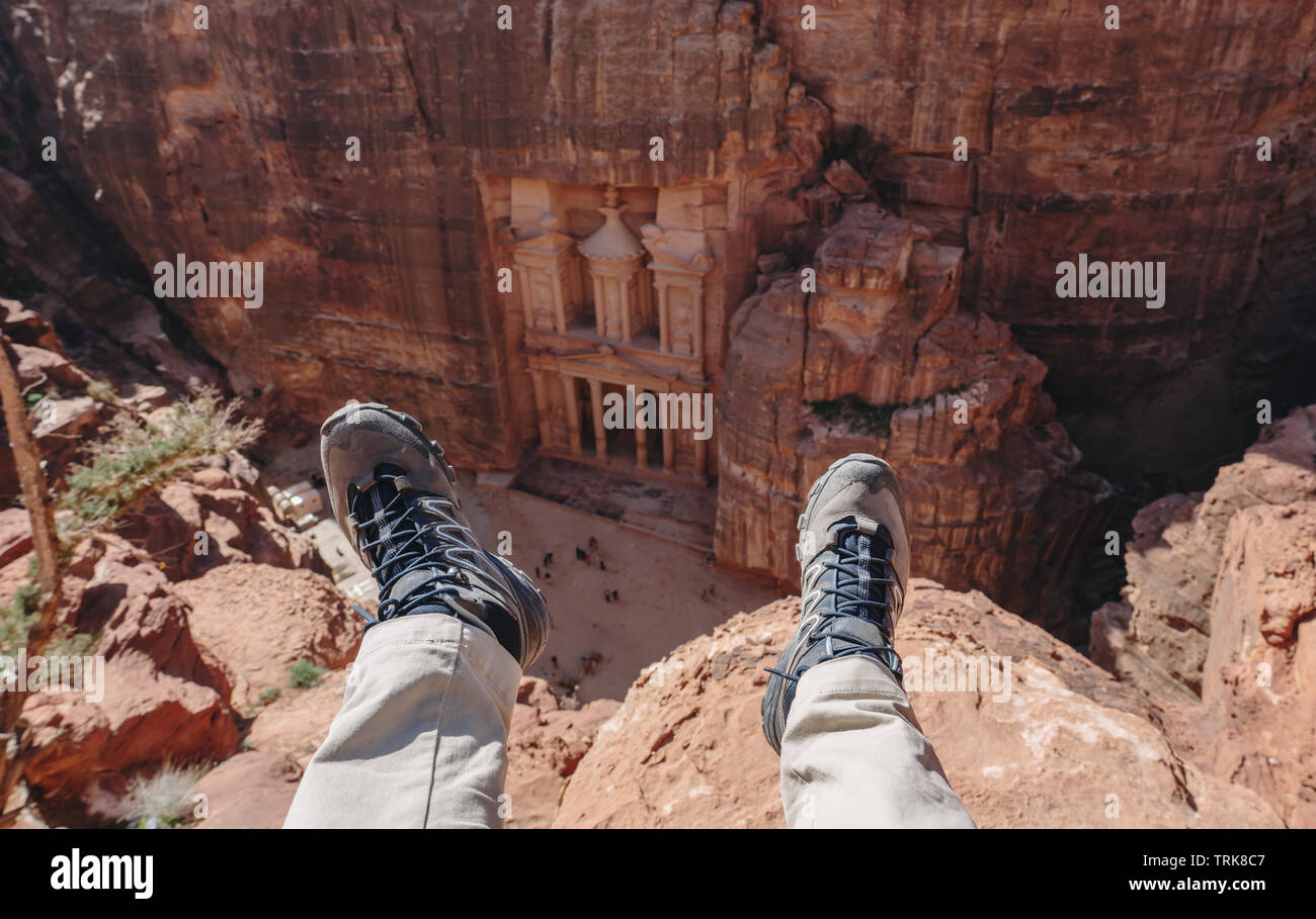 Travelling in Petra, the rose city in Jordan. Traveler enjoying high angle view of ancient architecture and landmark of Middle East in Petra, Jordan Stock Photo