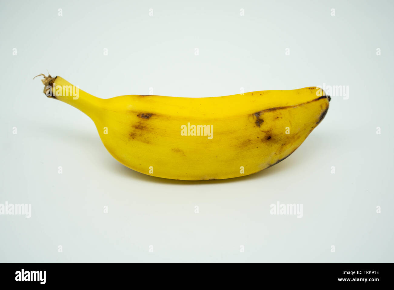 single ripe short banana on an isolated white background Stock Photo - Alamy