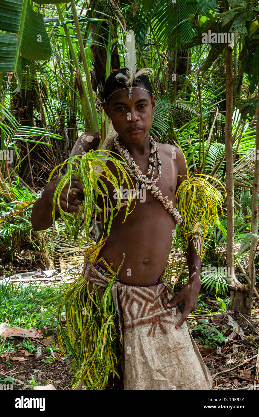 young Kofure Man in traditional Tapa Dress, Tufi, Oro Province, Papua New Guinea Stock Photo