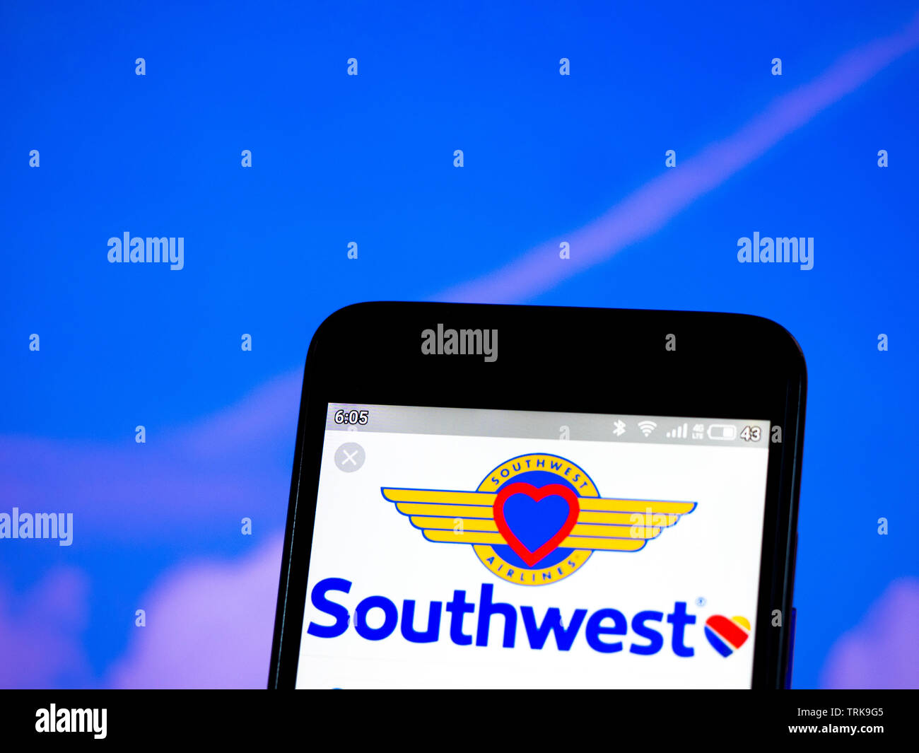 In this photo illustration the Southwest Airlines logo is seen displayed on a smartphone Stock Photo