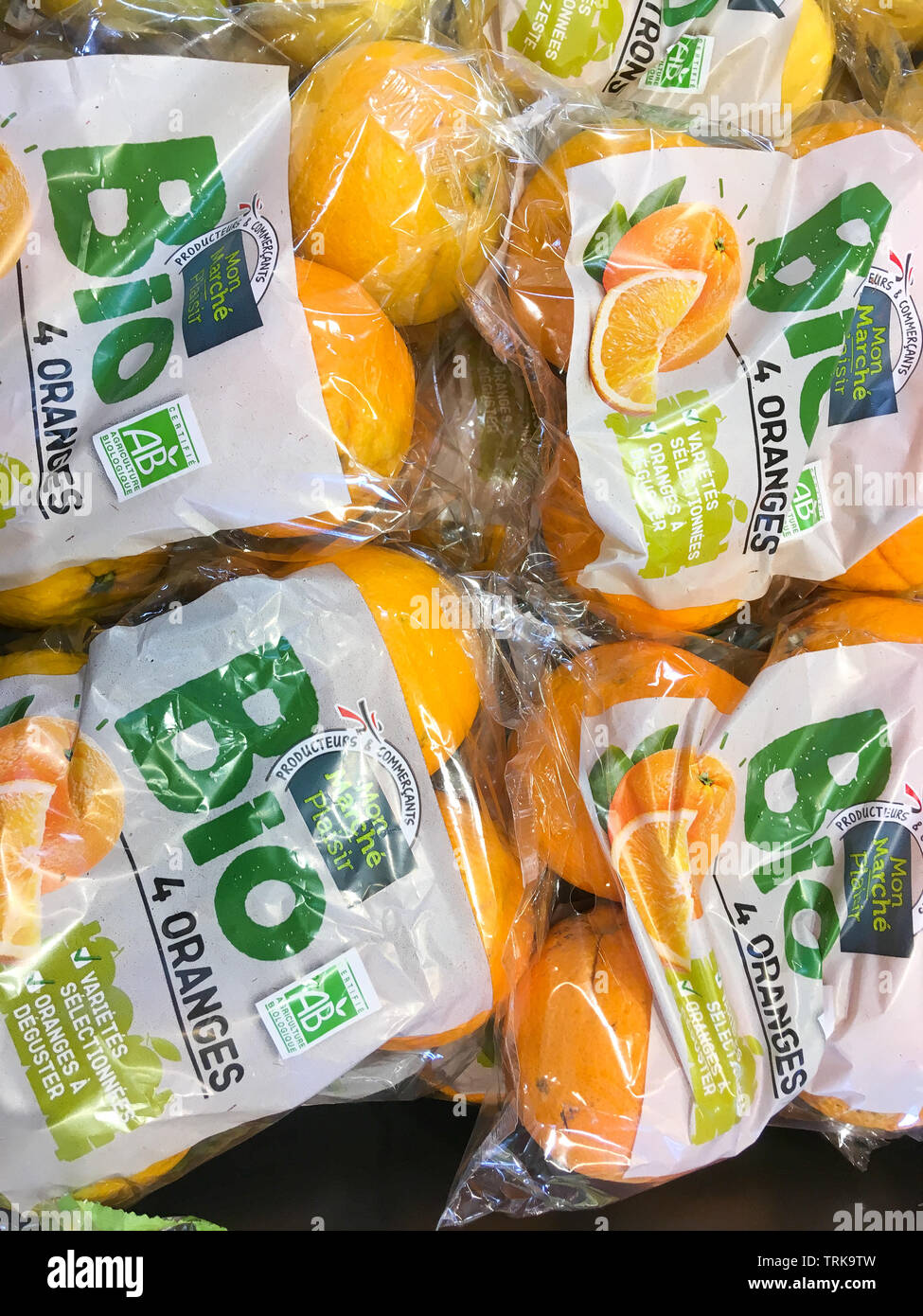 Organic oranges packaged in plastic blister packs, France Stock Photo