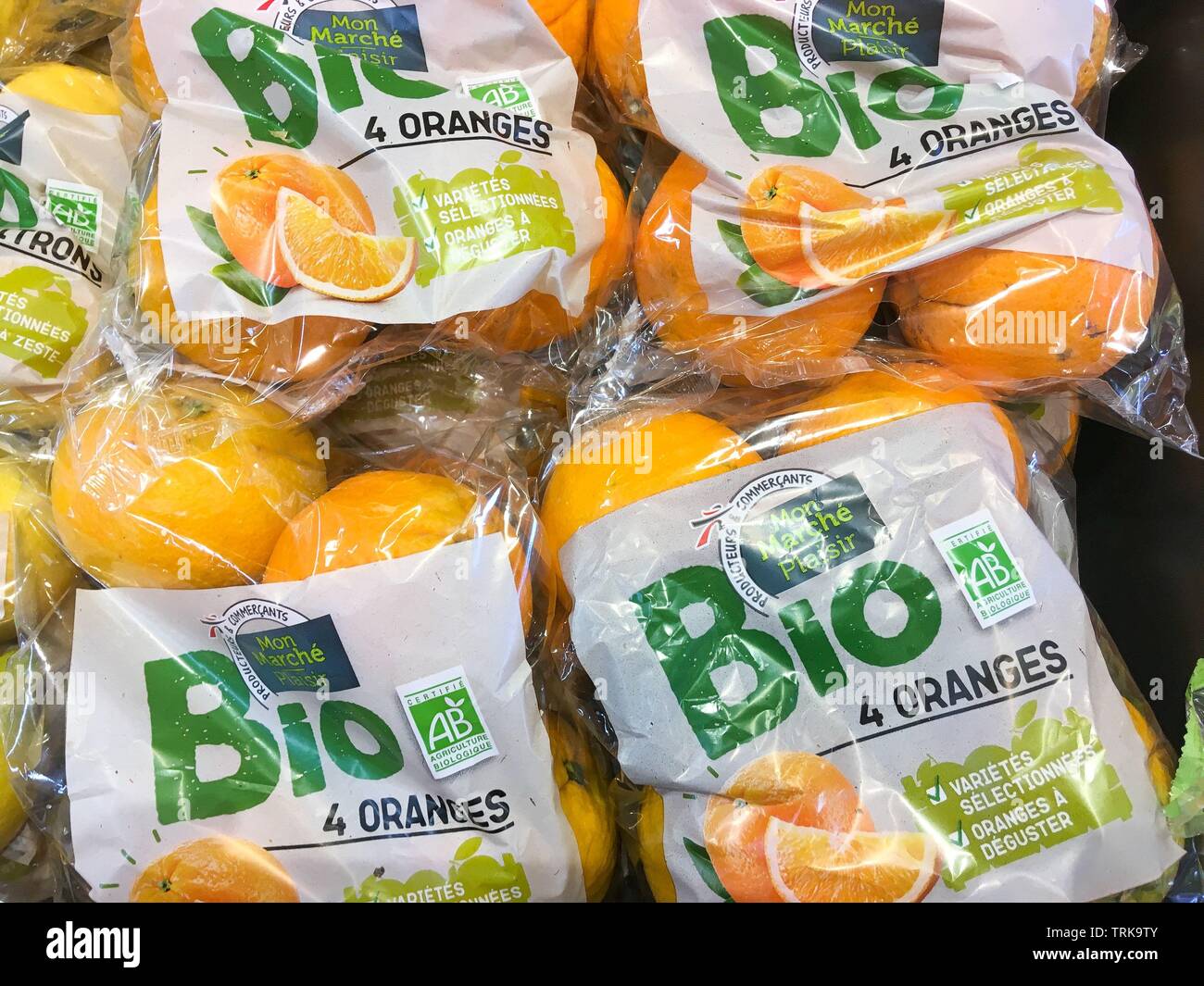 Organic oranges packaged in plastic blister packs, France Stock Photo