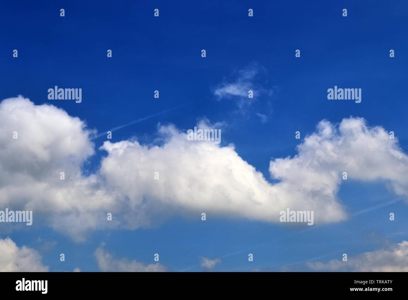 Beautiful calming fluffy white clouds in a deep blue summer sky Stock ...