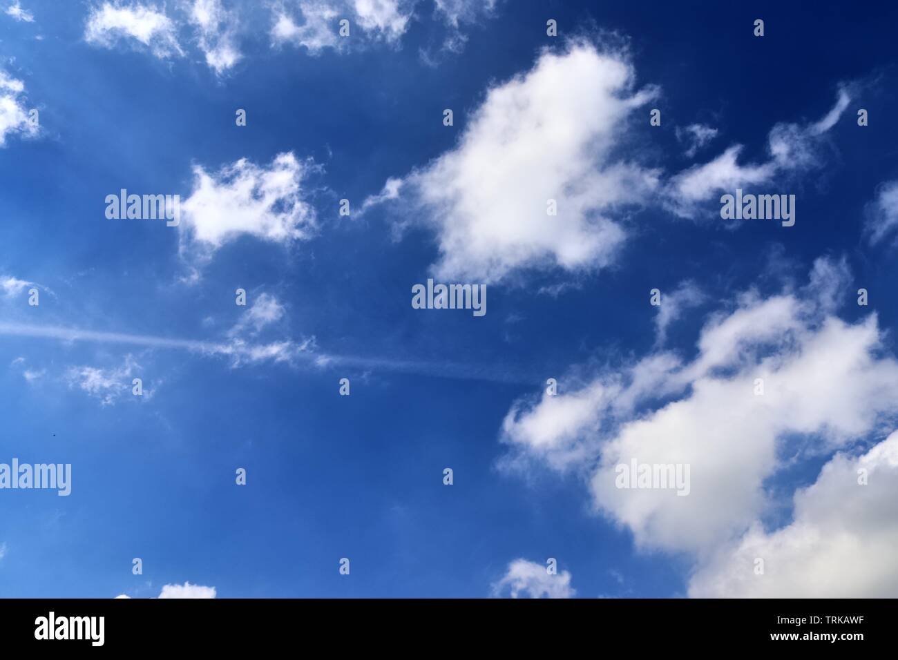 Beautiful calming fluffy white clouds in a deep blue summer sky Stock ...