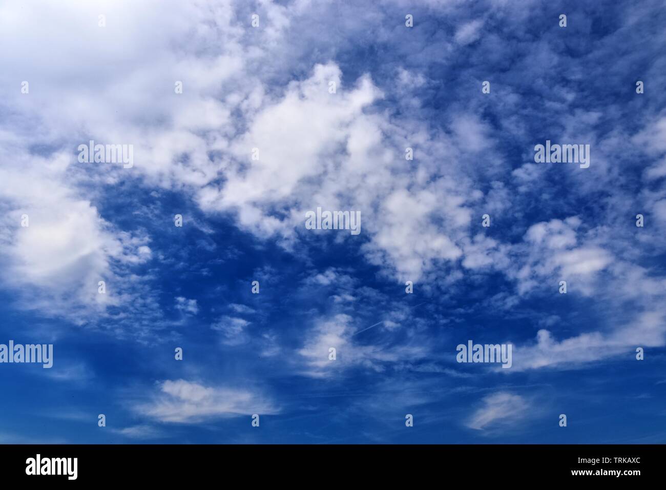 Beautiful calming fluffy white clouds in a deep blue summer sky Stock ...