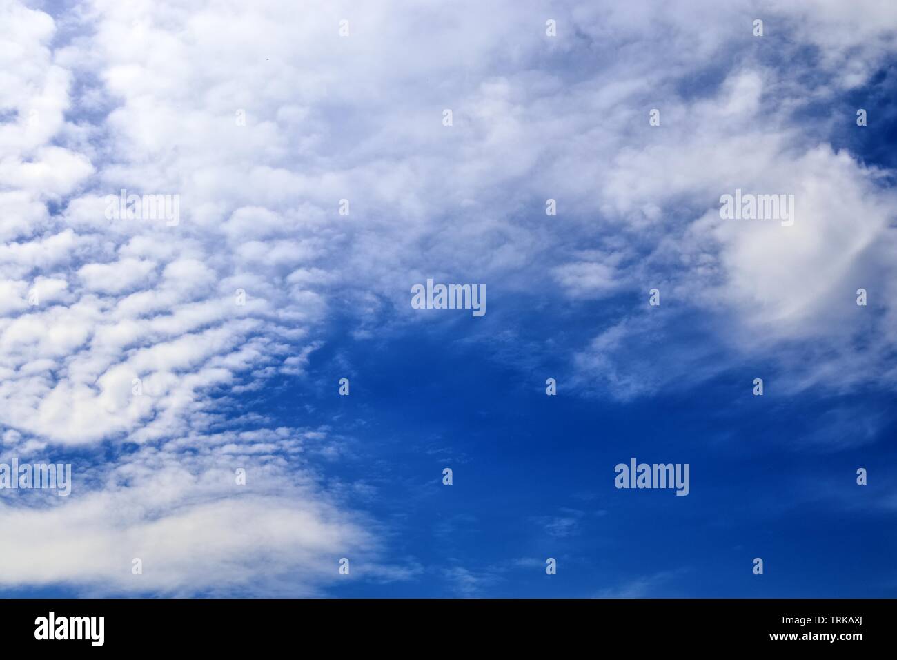 Beautiful calming fluffy white clouds in a deep blue summer sky Stock ...