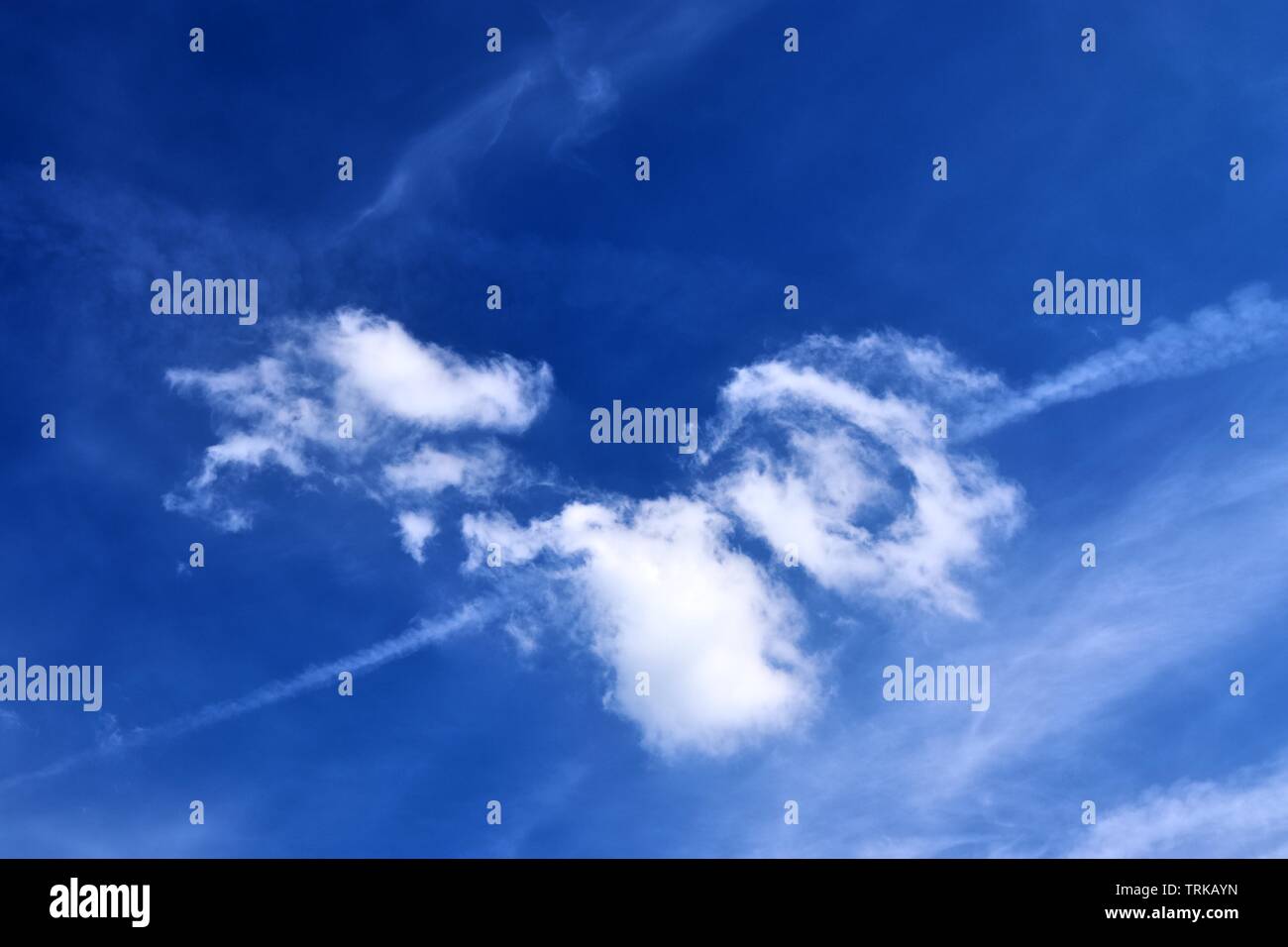 Beautiful calming fluffy white clouds in a deep blue summer sky Stock ...