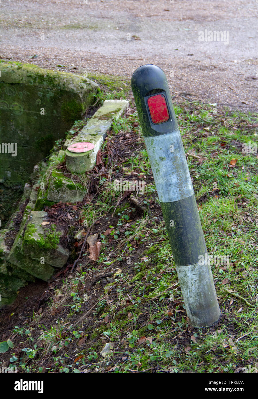 Collapsing roadside warning post Stock Photo - Alamy