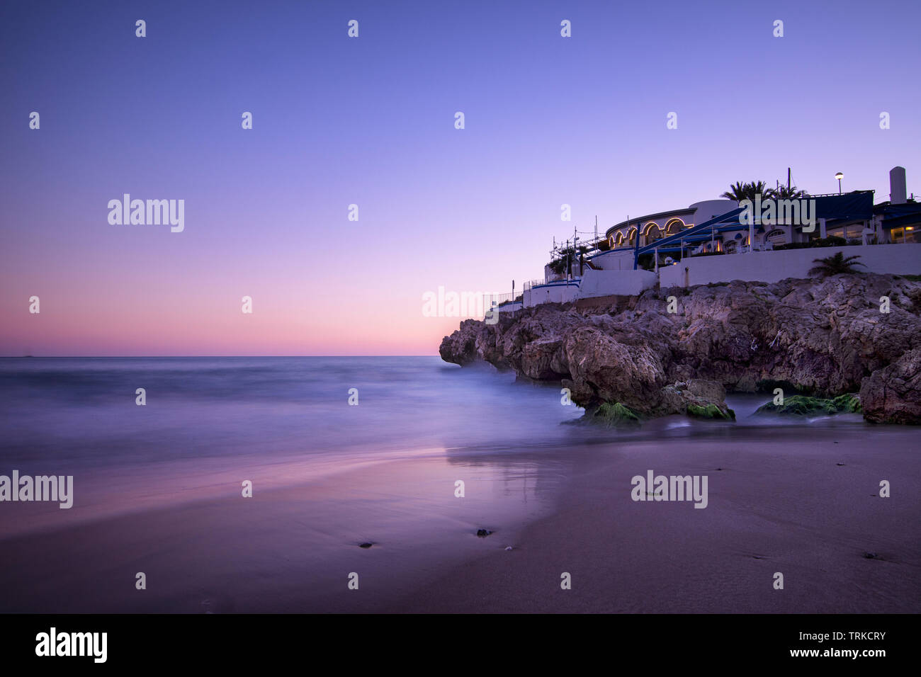 Beach at dusk blue hour Stock Photo - Alamy