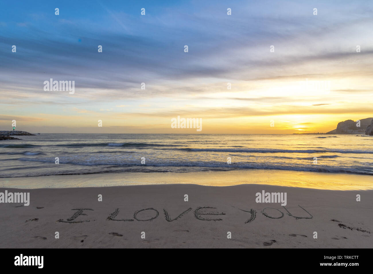 written i love you in the sand on the beach Stock Photo - Alamy