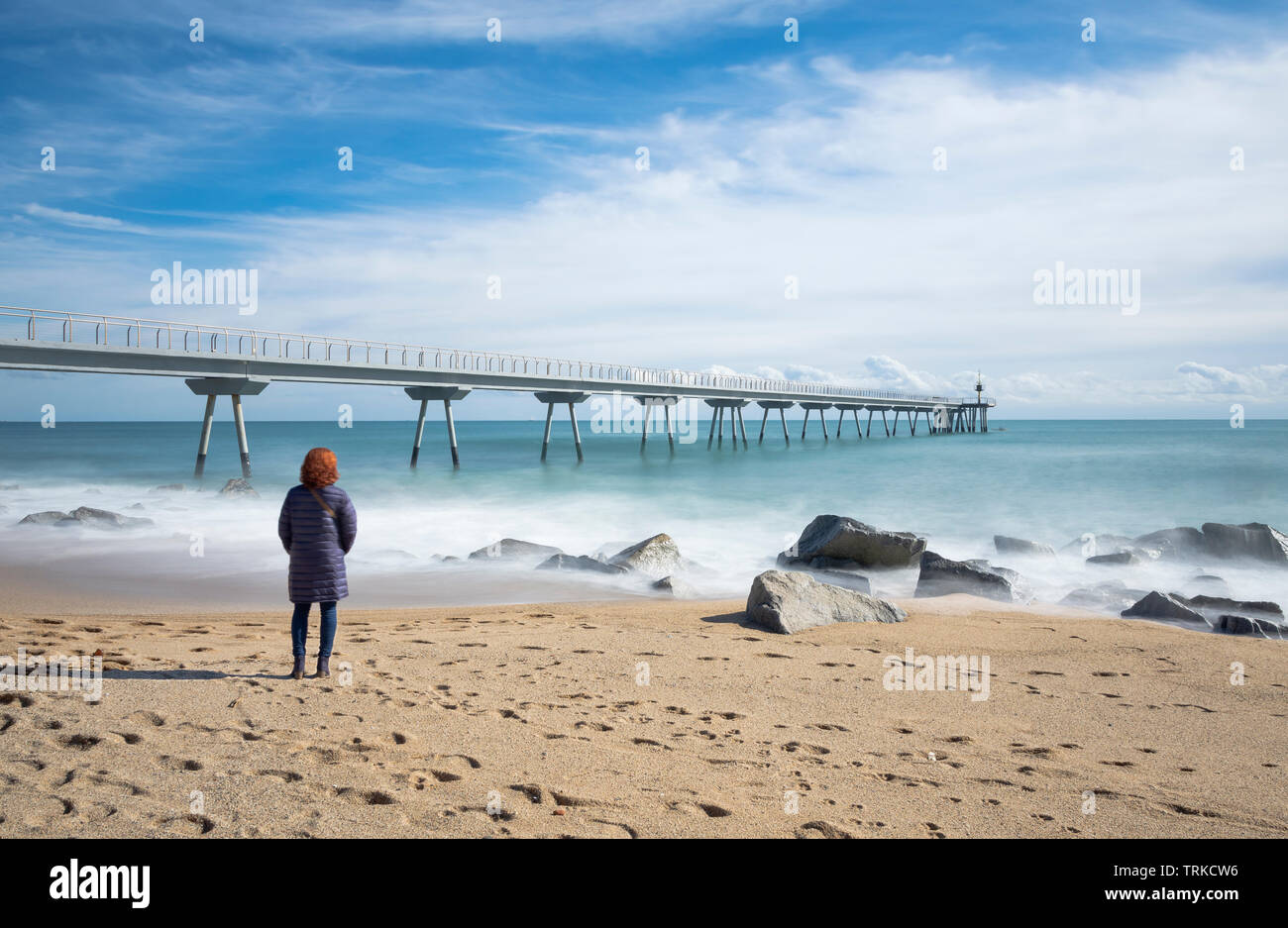 contemplating the bridge in the sea Stock Photo