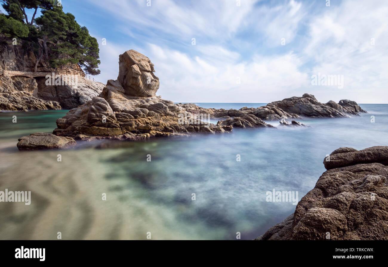 Rocky beach landscape of the Costa Brava, Catalonia, Spain. Extraordinary rock formations in the sea. Cala de la Roca del Pallar Stock Photo