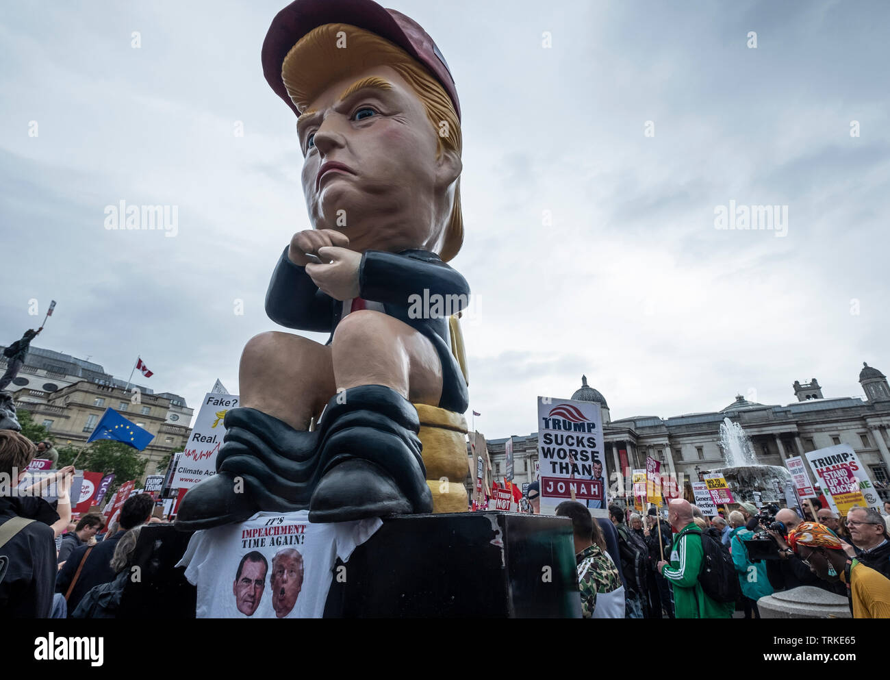 Giant Donald Trump effigy sitting on toilet at 'Carnival of Resistance' Anti-Trump Protest in London  during US President Trump's visit in Downing Street. Stock Photo