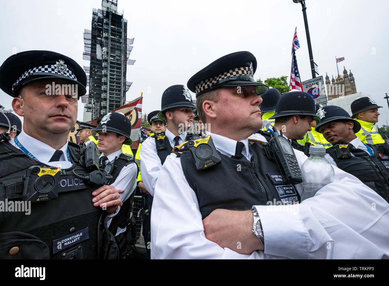 Police outside Parliament with body warn video cameras policing 'Carnival of Resistance' Anti-Trump Protest in London  during US President Trump's visit in Downing Street. Stock Photo