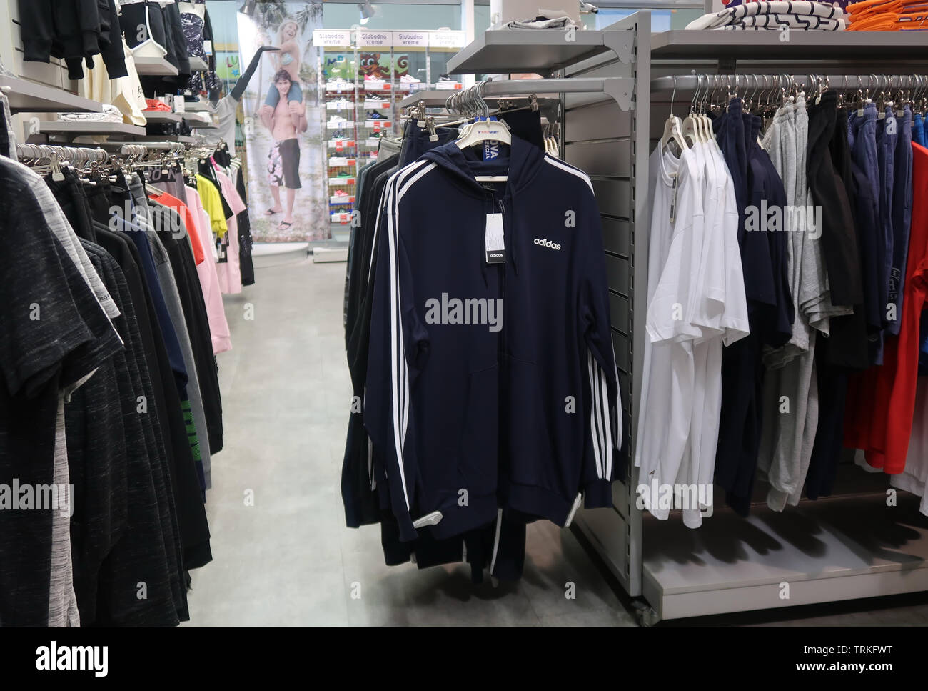 Clothes hanging in a shopping mall Stock Photo - Alamy