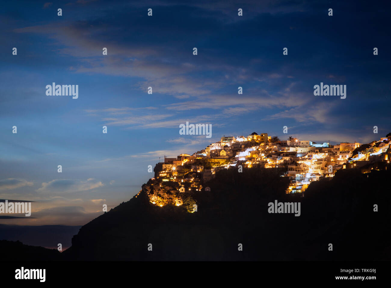Imerovigli drips over the caldera cliffs of Santorini, Greece. Stock Photo
