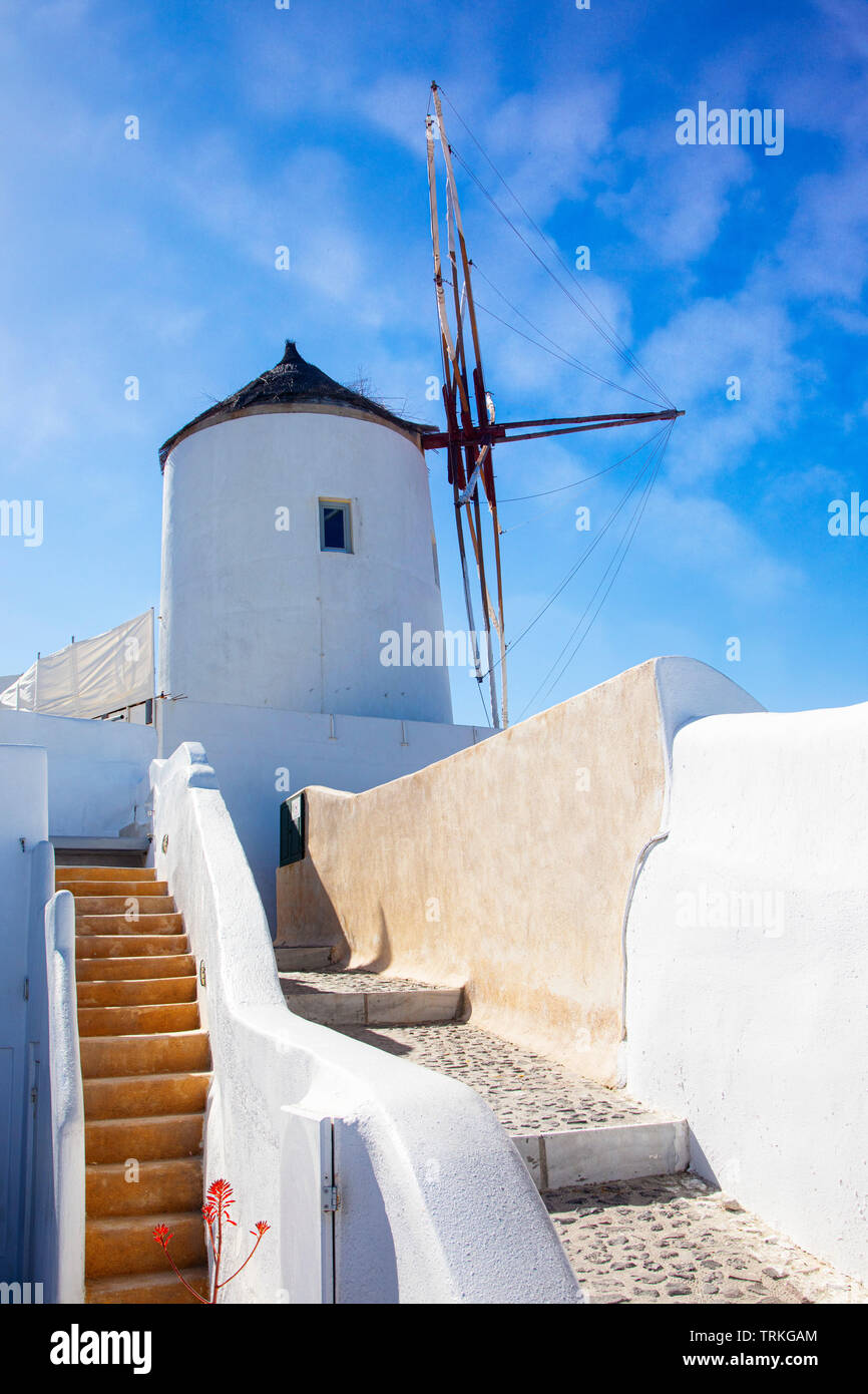 Blue skies over the Agean Sea and one of the windmills of Oia on Santorini, Greece. Stock Photo