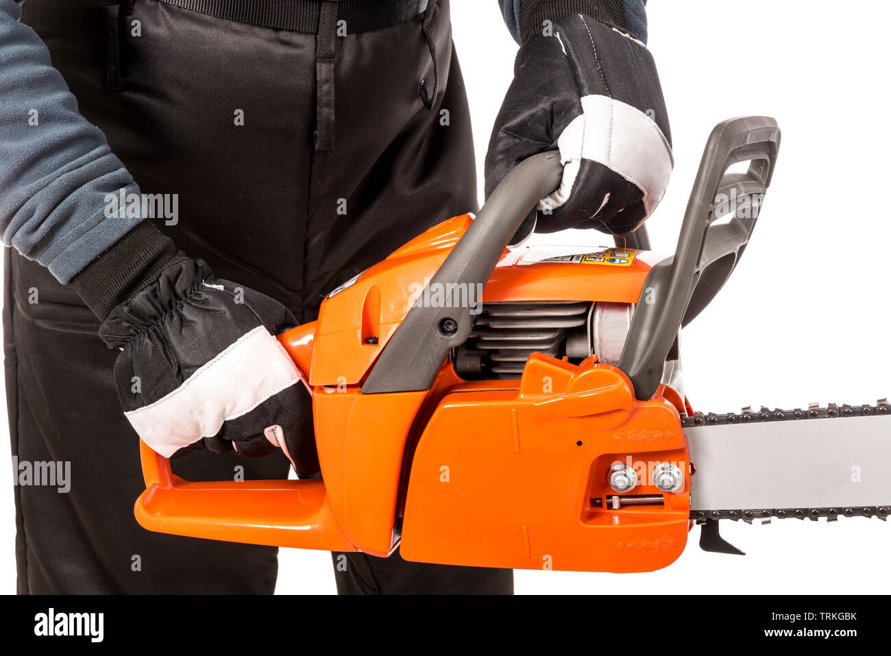 Hands showing how to hold a chainsaw safely Stock Photo