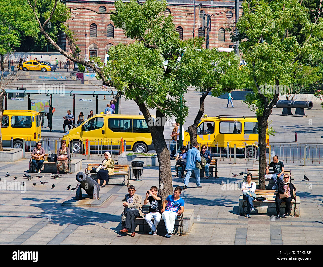 Istanbul, Turkey - 05/26/2010: People sitting on benches at bosporus