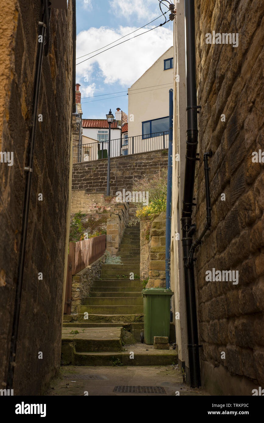Stepped alleyway between village houses in Staithes, East Yorkshire, UK