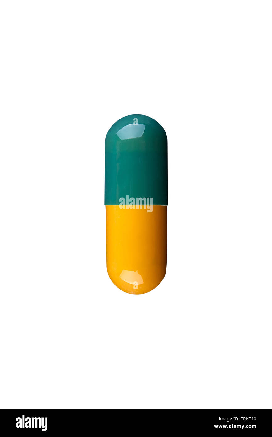 Macro photo of green and yellow capsule. Isolated on white background