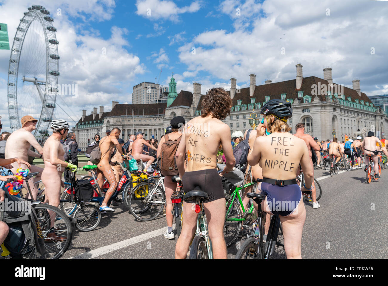 08 Jun 2019, London, UK. Naked cyclists take part in the 16th annual naked bike ride by riding bicycles on Westminster Bridge Stock Photo