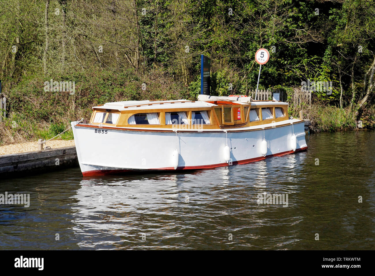 A well restored example of a large wooden hulled motor cruiser from the 1930's, a type once common on the Norfolk Broads. Stock Photo