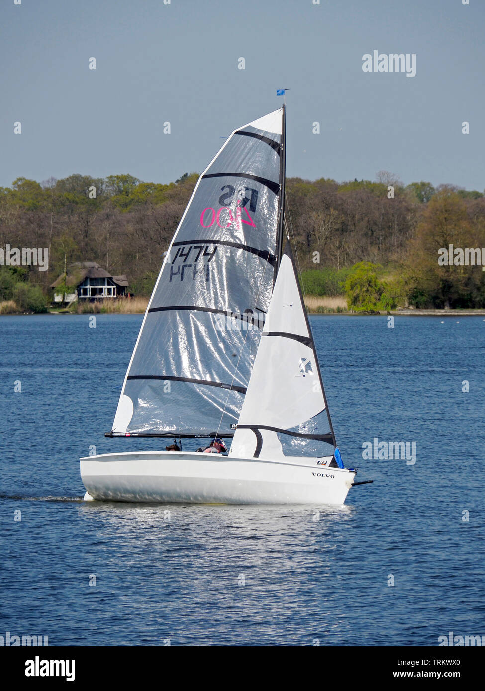 Sailing is a popular pastime on the Norfolk Broads with dinghies of various types taking part in racing and sail training on Wroxham Broad. Stock Photo