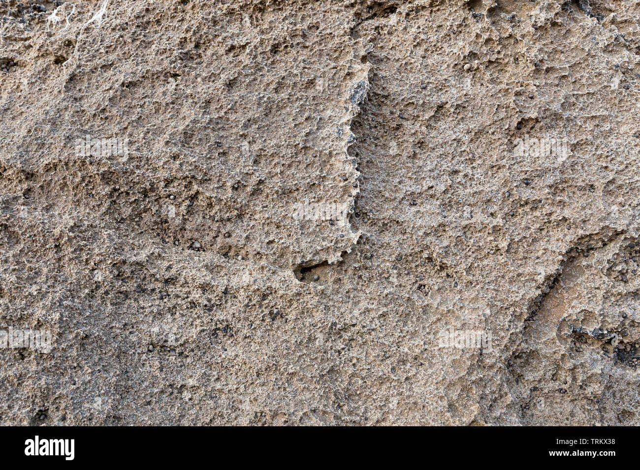 Detail of abstract brown stone texture. For background textures. Natural background to be used in old architecture context as rough wallpaper. Stock Photo