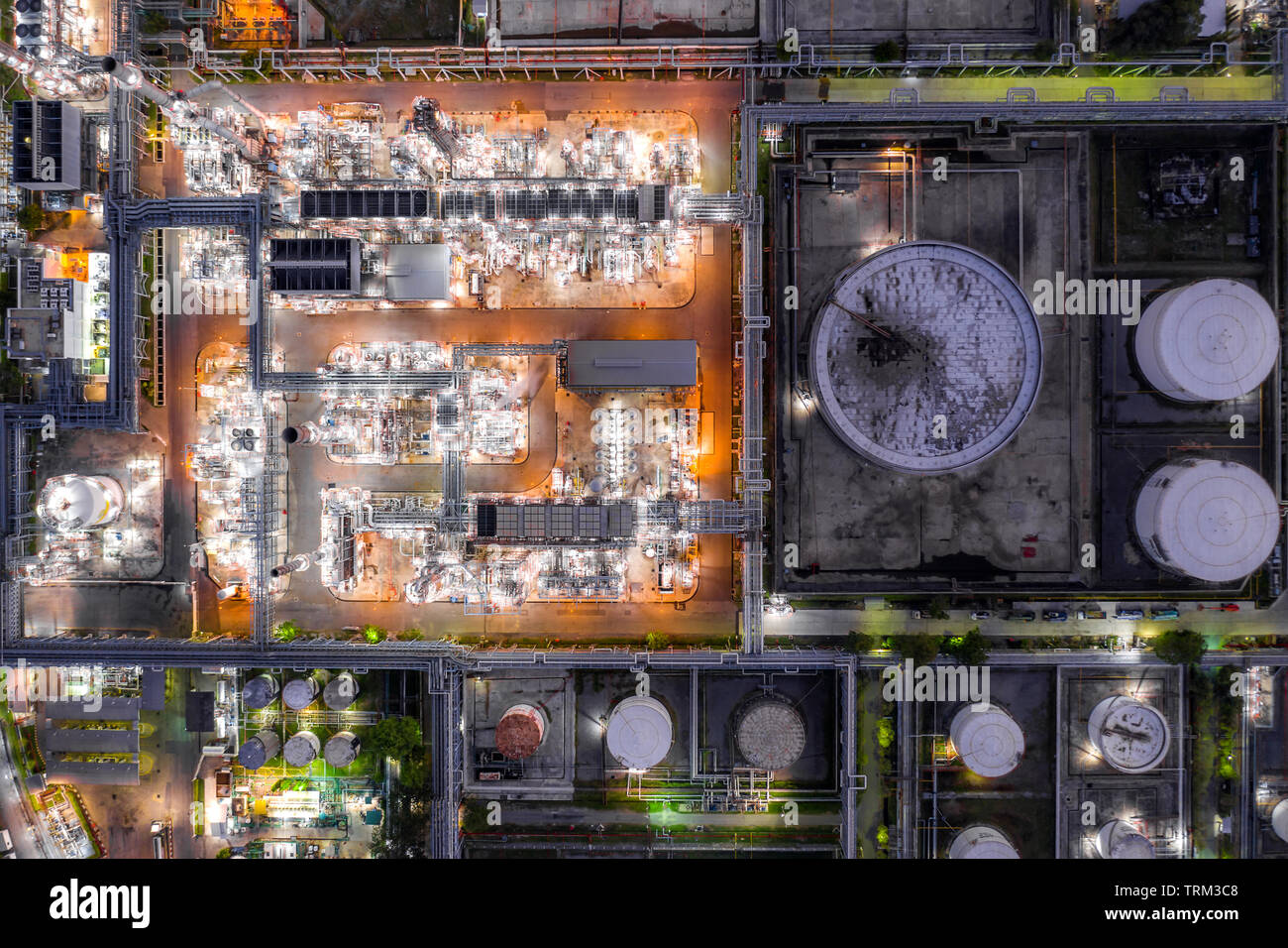 Aerial view oil refinery and gas refinery plant form industry zone at night. Stock Photo