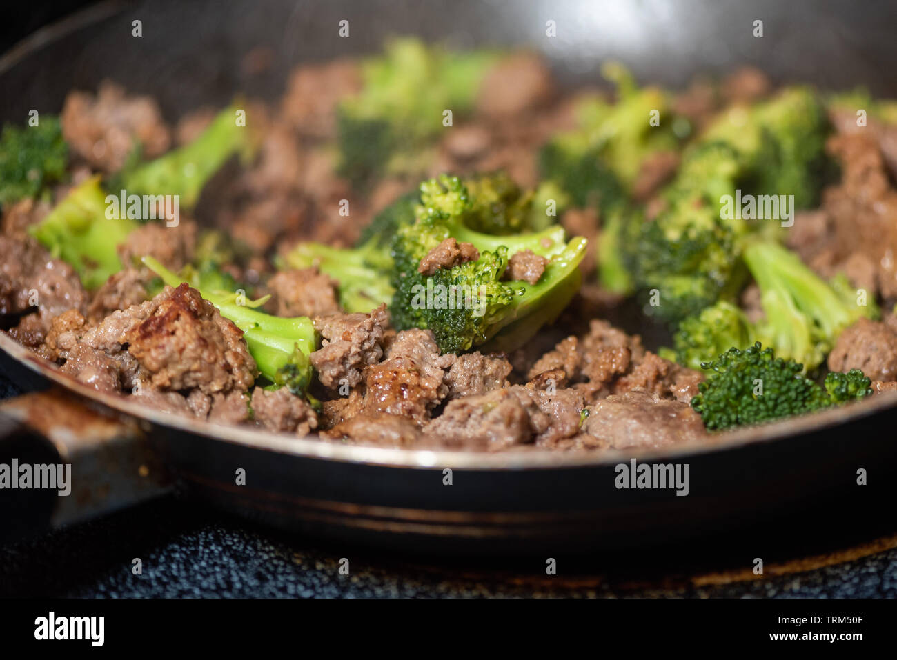 Broccoli and ground meat in a skillet Stock Photo