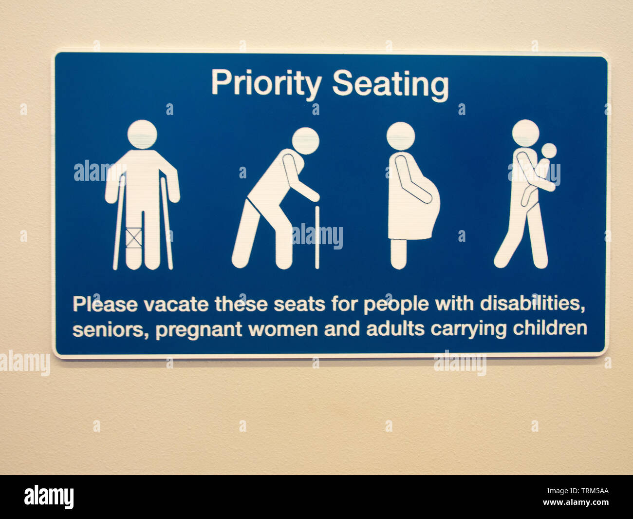 Priority Seating Information Sign On Public Transport Stock Photo