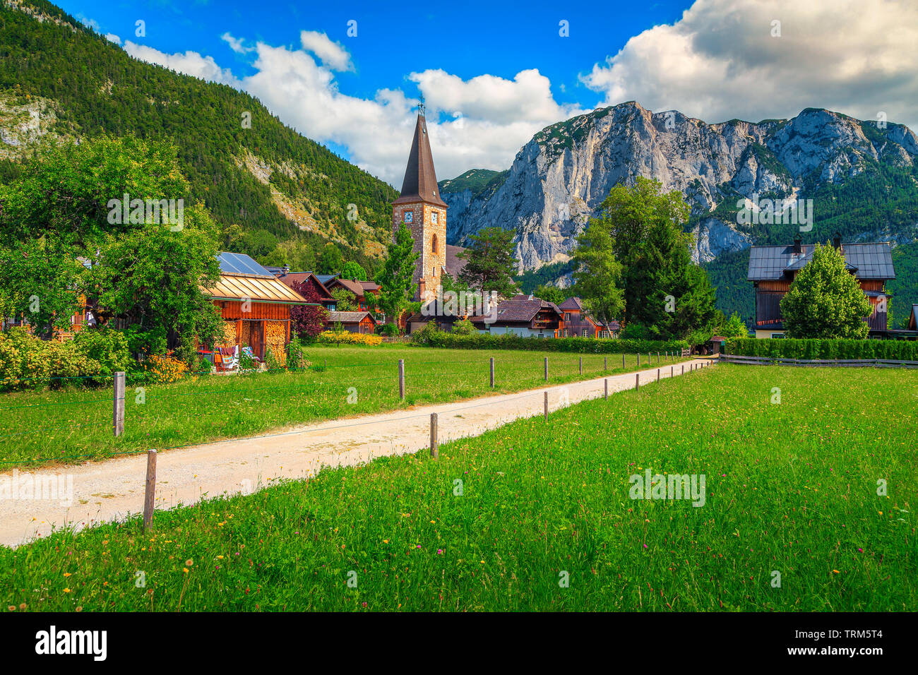 Spectacular summer vacation resort, alpine village with old church and high mountains, Lake Altaussee, Salzkammergut, Austria, Europe Stock Photo