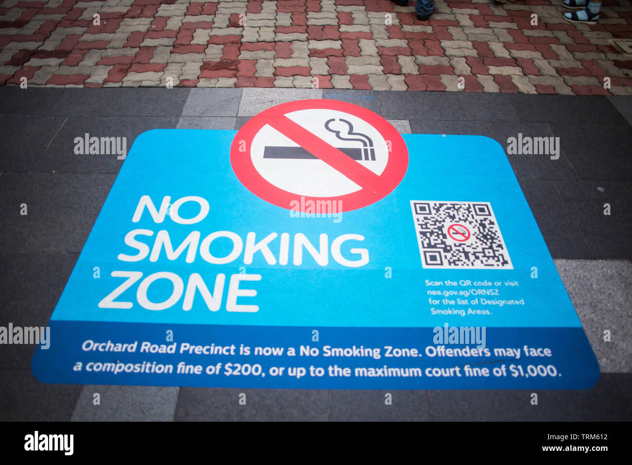 No Smoking Zone sticker paste on the floor, Orchard Road, Singapore Stock Photo