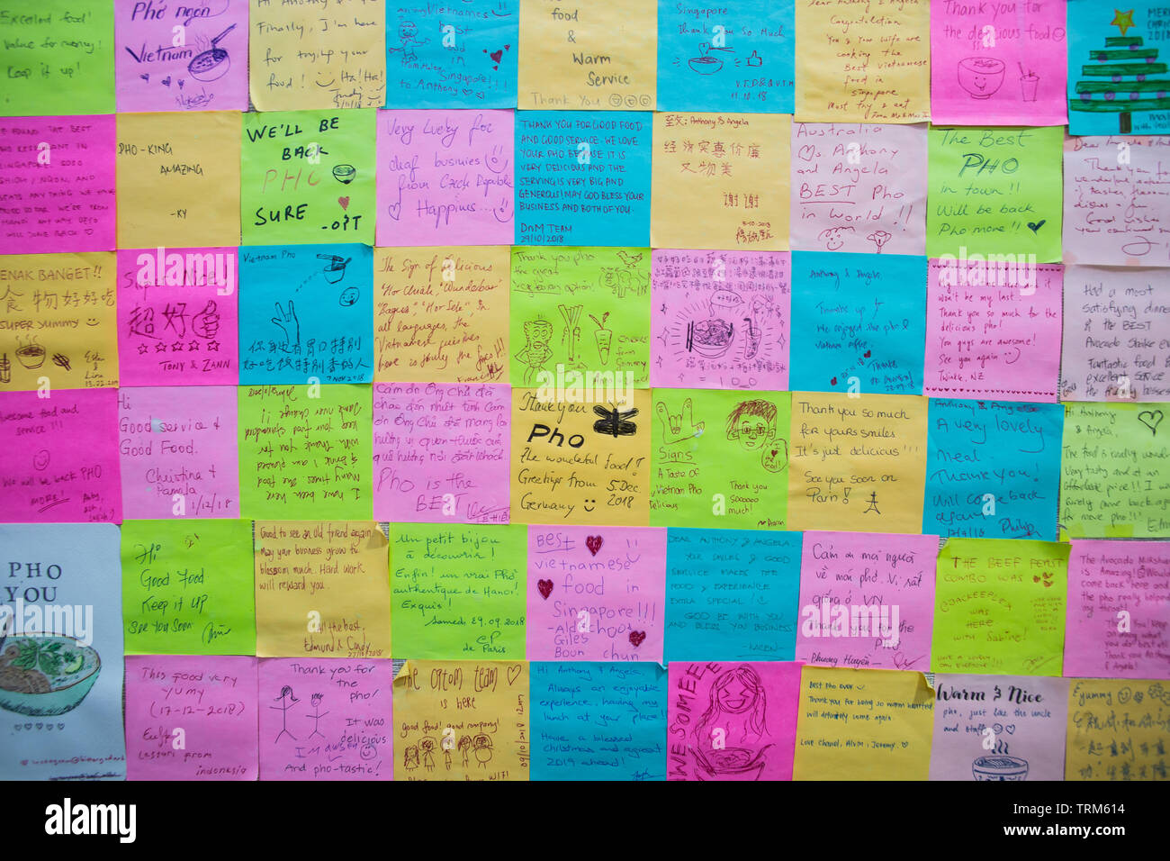 Sticky notes paste on the wall were written by patrons and travellers around the world to give love to the restaurant. Stock Photo