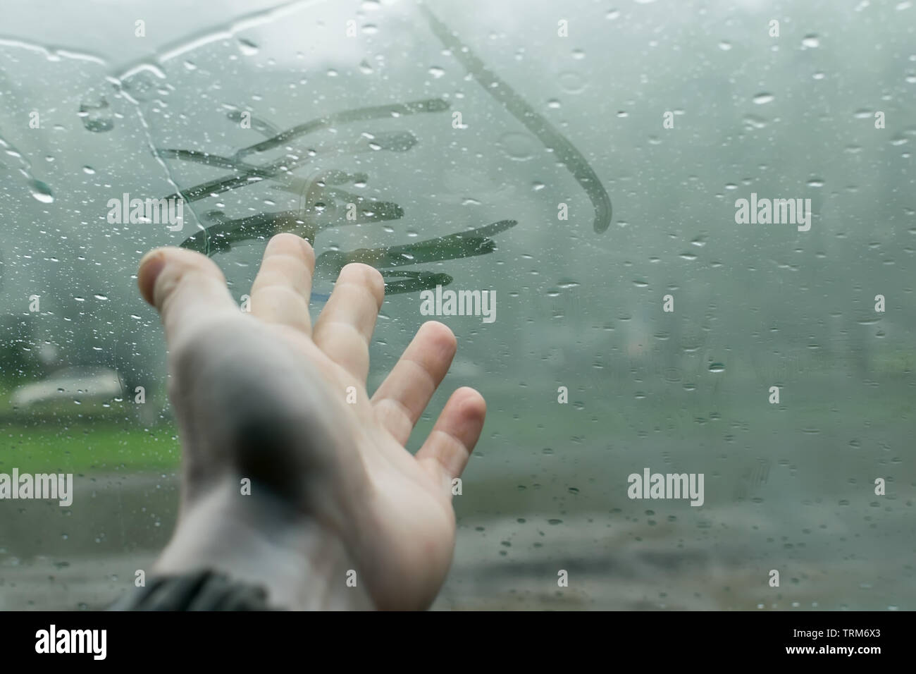 the human hand fingers drawing lines on a sweaty moisture from the