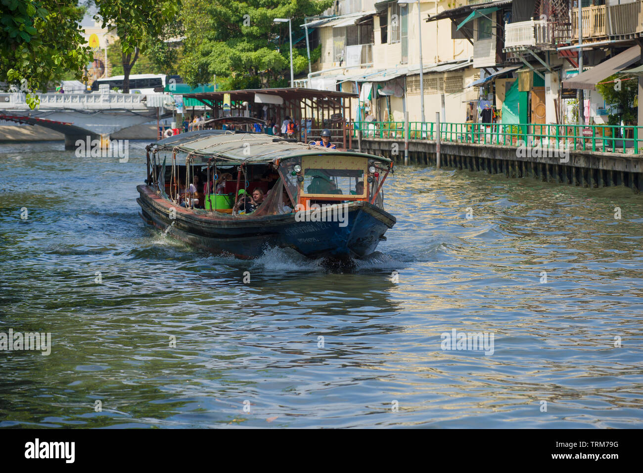 BANGKOK, THAILAND - DECEMBER 29, 2018: Passenger route boat on the city canal on a sunny afternoon Stock Photo