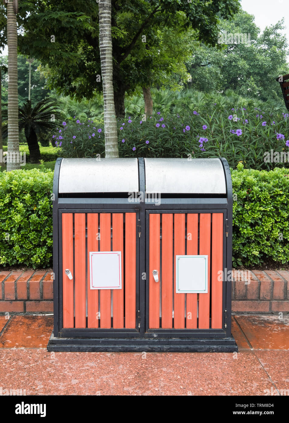 Two wooden bin for general waste and recyclable waste in public garden