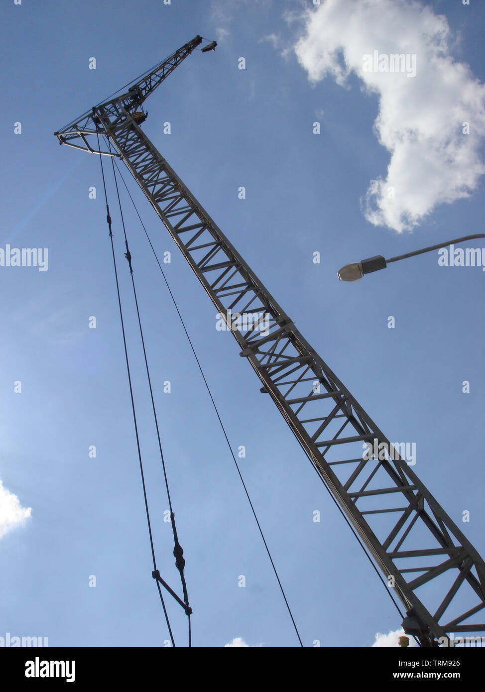 Abstract Industrial background with construction crane on blue sky ...