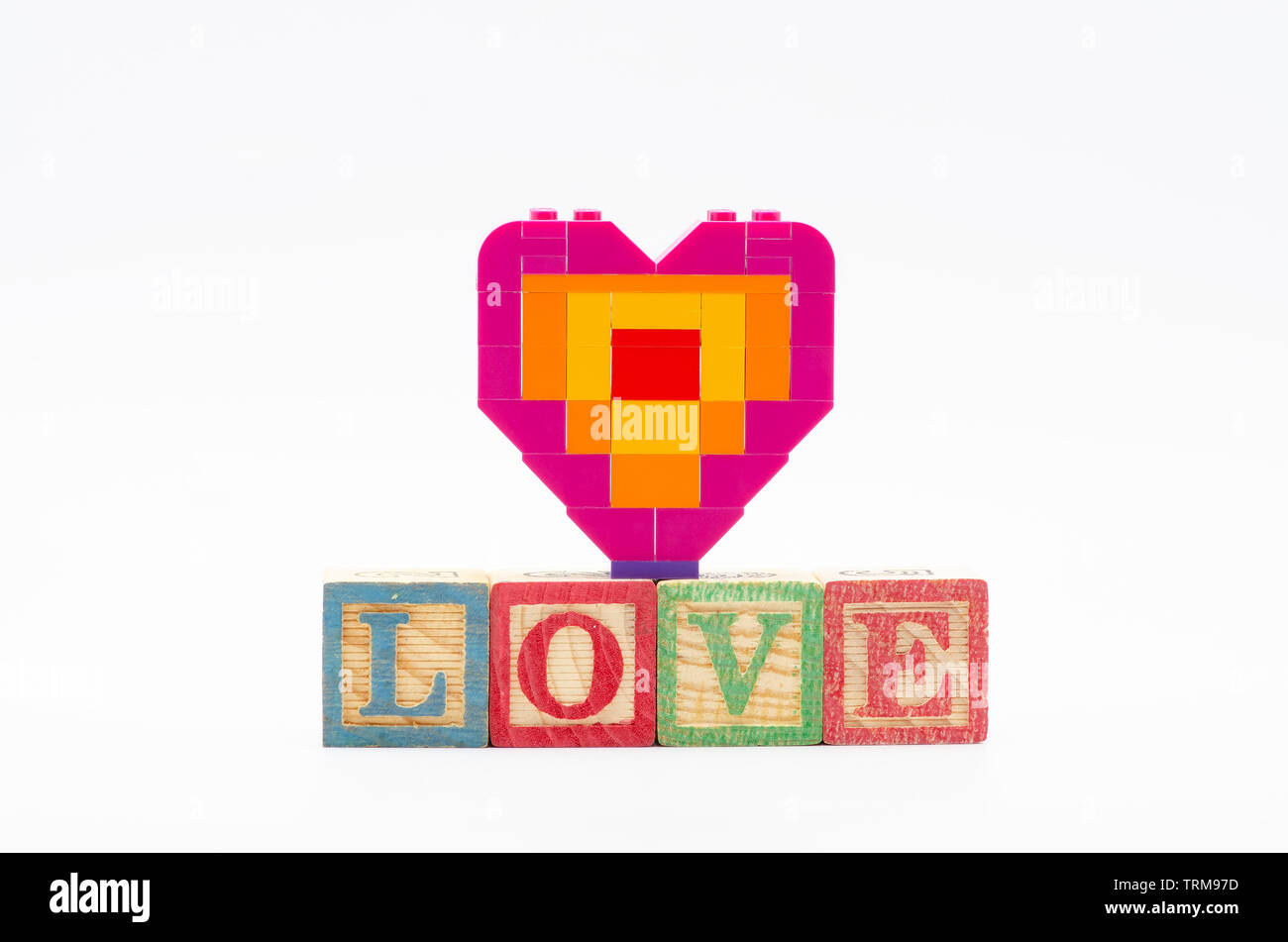 lego piece offering heart shape with word love. Lego minifigures are