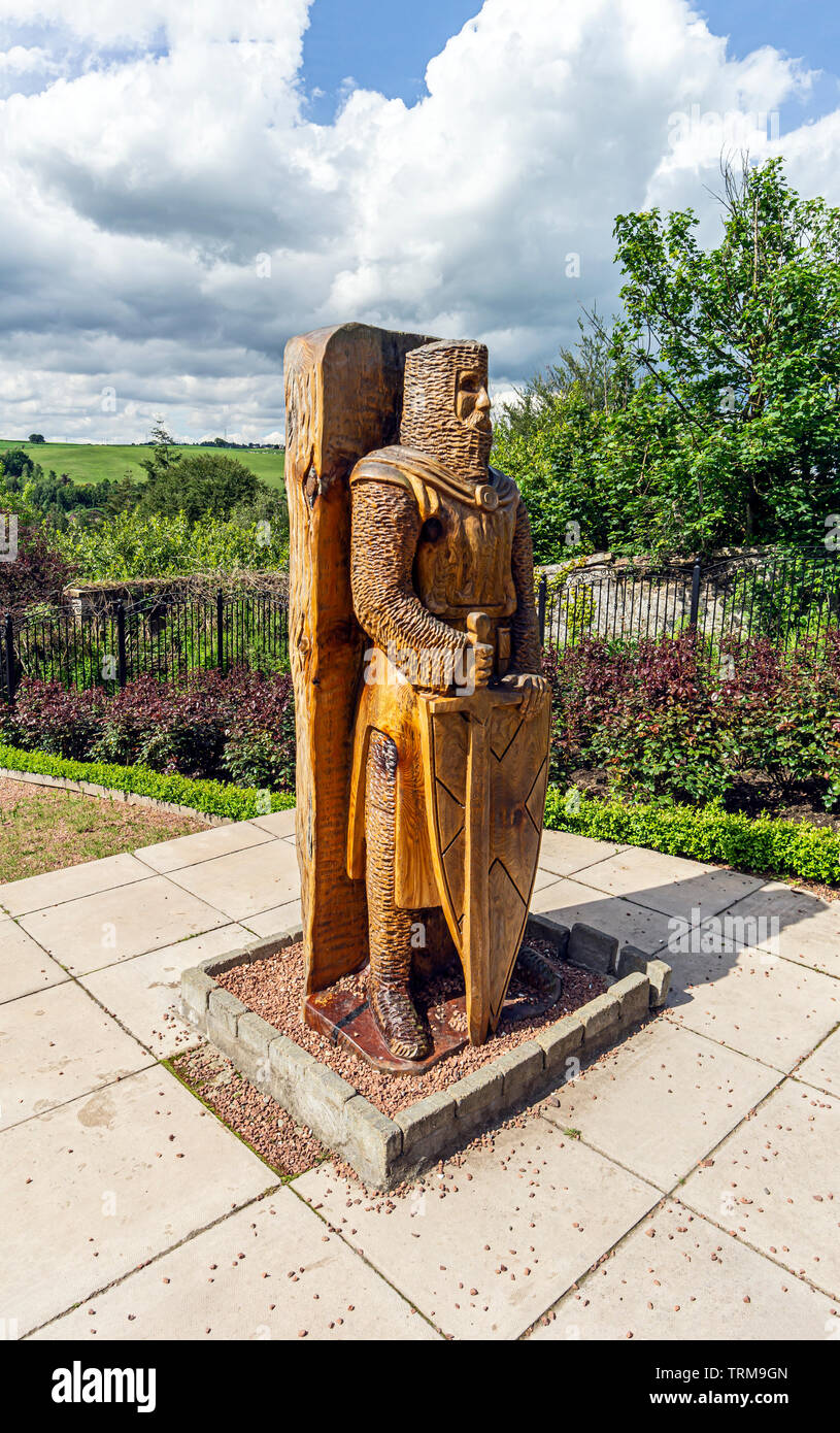 Wooden statue of Braveheart Sir William Wallace in the Rose Garden Castlebank Park Lanark South Lanarkshire Scotland UK Stock Photo