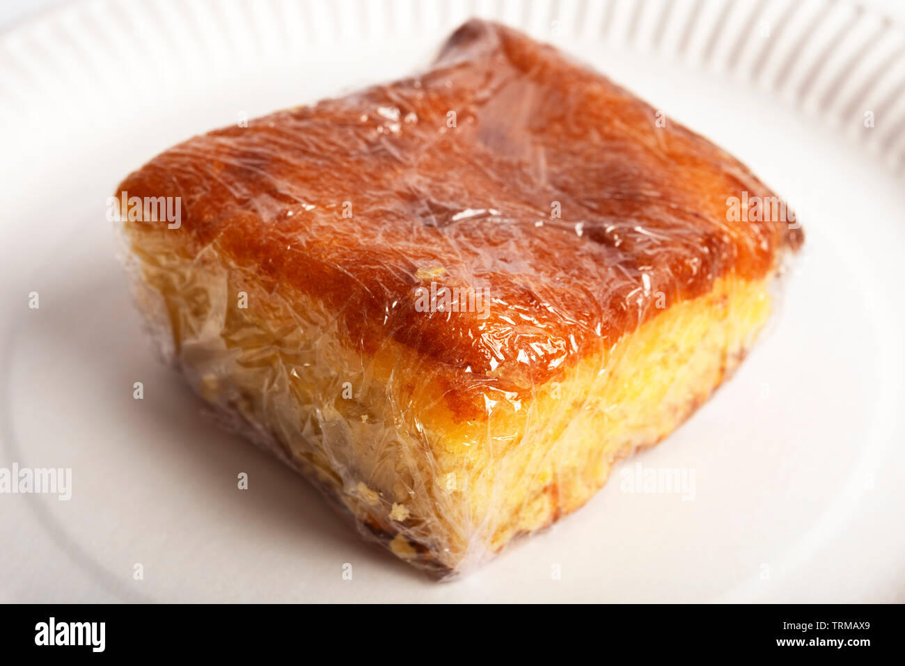 cake wrapped in clingfilm Stock Photo