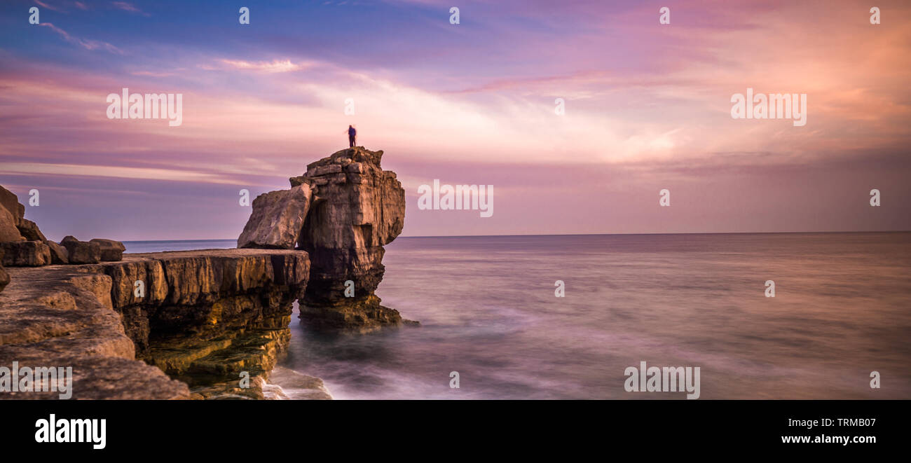 Sunset over Pulpit Rock at Portland Bill on the Isle of Portland near Weymouth on Dorset's Jurassic Coast. England. UK. Stock Photo